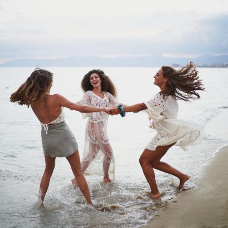 three-women-making-circle-and-turning-together-whi-2022-05-05-16-33-35-utc-1024x683
